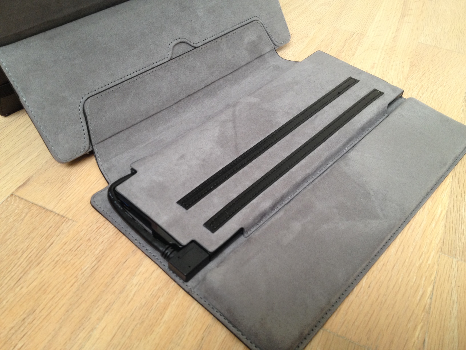 The dock cover sacrifices one of the stopping strips for a padded palm rest. When it's not connected to the Surface Pro, the connector cable on the left side of the dock cover is tucked safely out of the way. Pulling the cable out of its housing can take some effort.