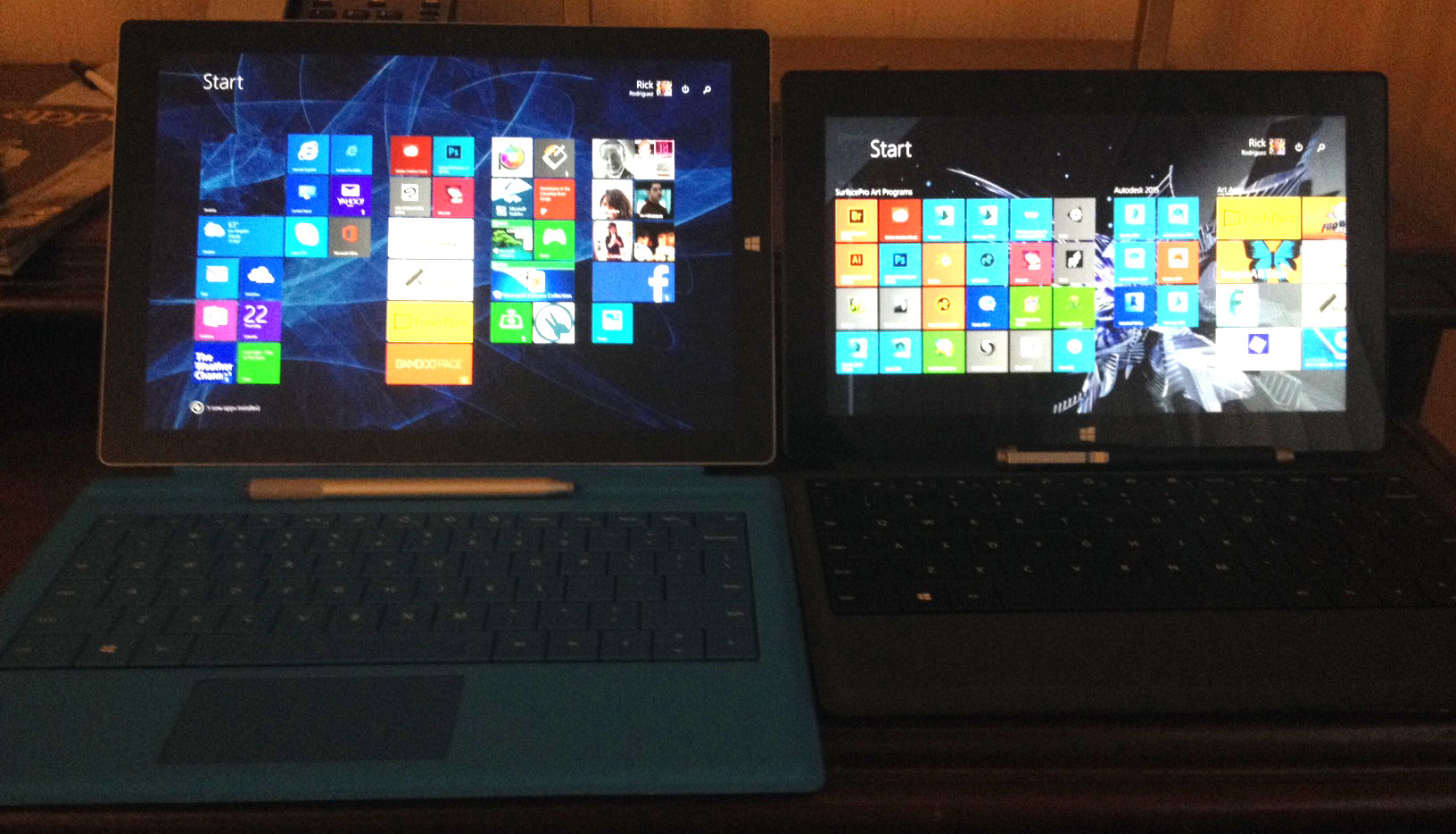 The Surface Pro 3 with new type cover next to the Surface Pro 2 with power cover. Pardon the dark hotel lighting.