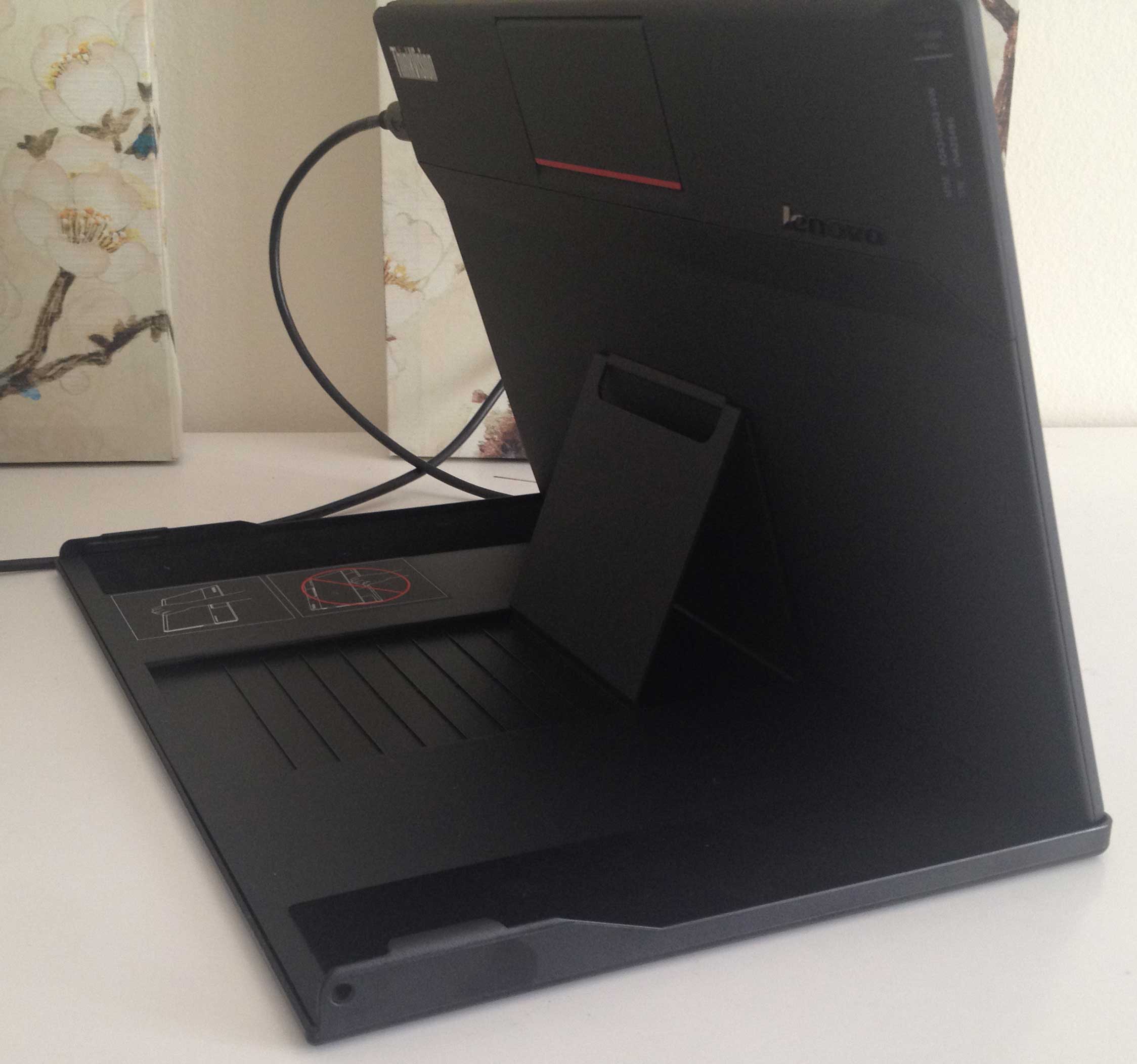 The cover stand at 70 degrees. The monitor's USB cables can be a bit of a tangle and can only connect to devices with two free USB 3 inputs.