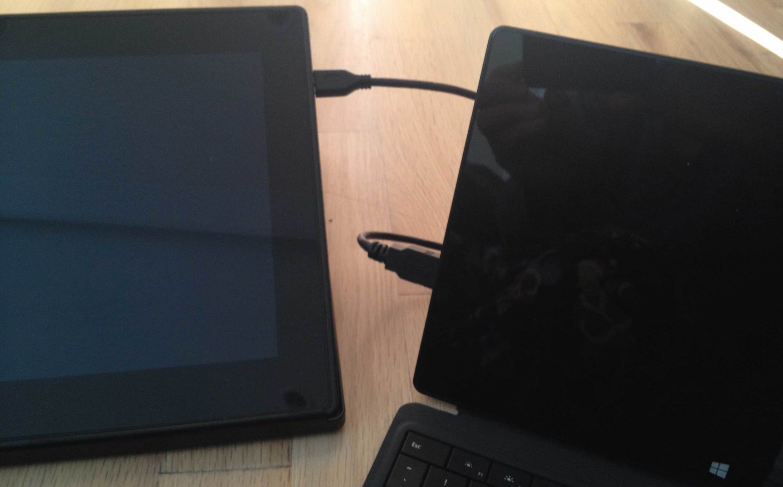 The second cord from the USB 3.0 Y cable plugs into Surface Pro's USB input (right). You'll need to have the DisplayLink drivers loaded and the Surface Pro turned on before attaching this cable. Your DisplayLink driver will initialize and the monitor will turn on. You may also need to configure your monitors in the Wacom feel driver control panel. In my limited tests, this sometimes requires a couple of restarts and reinstalls of drivers to get working. This is definitely not recommended for the easily frustrated! 