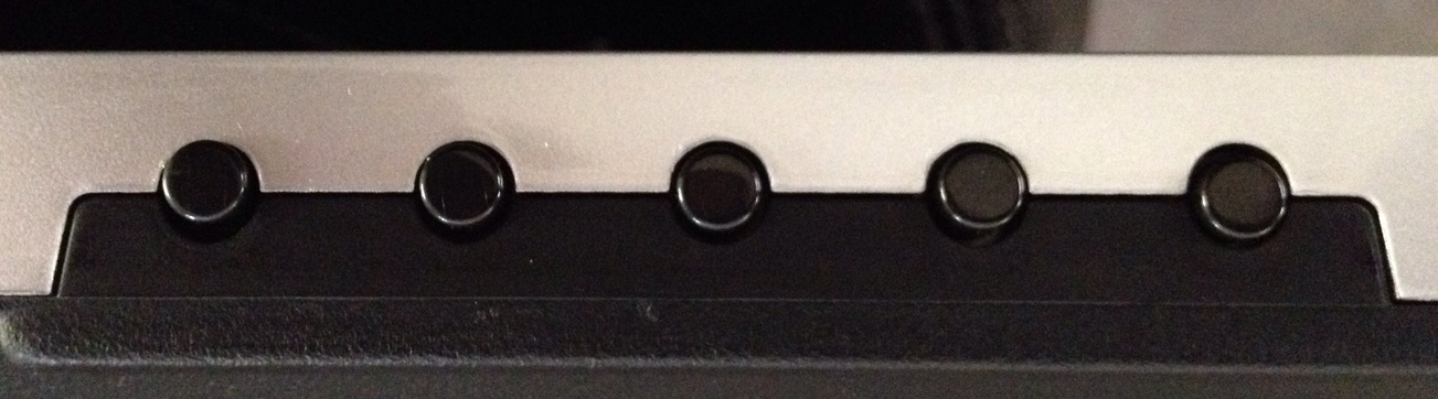 Also located along the lower right edge are the monitor adjustment and power buttons.