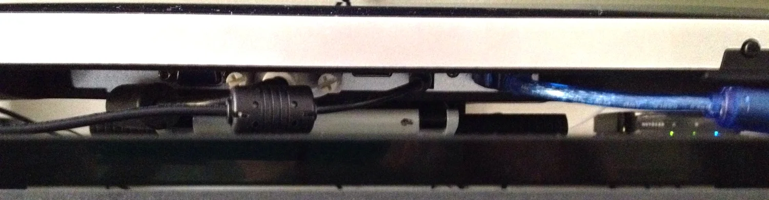 Because of their unfortunate placement, the cabling is easily tangled with the VESA stand. As the monitor angle is adjusted, you have to be careful to clear the cables so the stand can lie flat on your work surface.