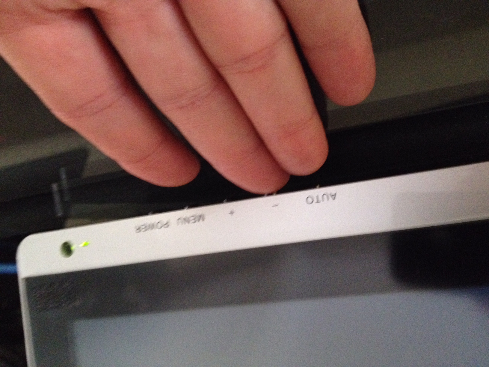 You'll have to hold your hand flat against your desktop to access the buttons. It's unfortunate they weren't moved to another edge. Of course, except for power, you won't need to access the display settings very often.