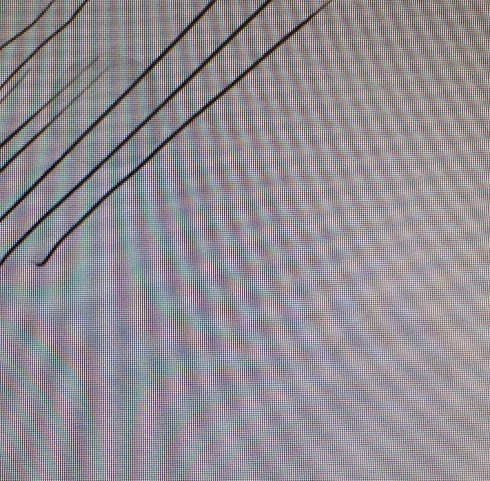 The gray circles appear whenever the display is touched. In this instance, the circles were displayed as the monitor received phantom input due to a loose USB connection.