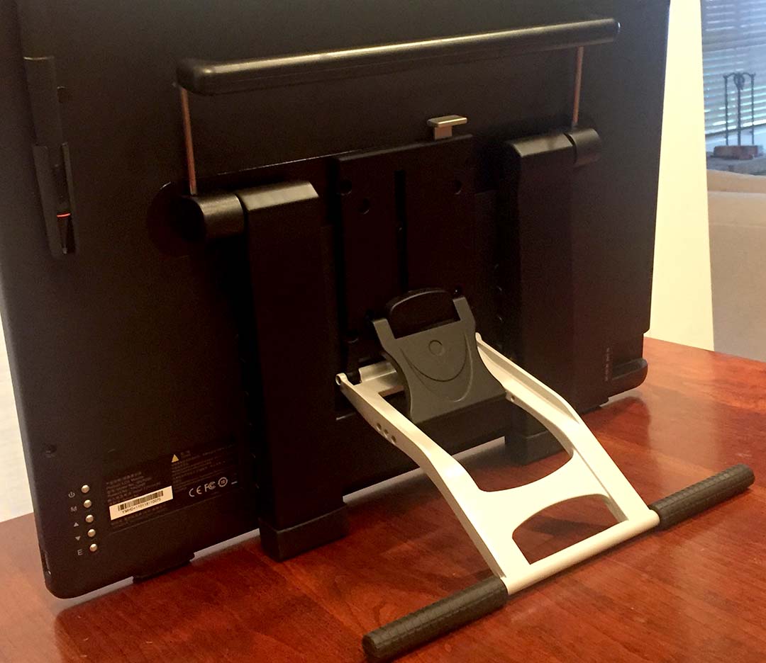 The pen holder in the top left back, detachable handle blocking the tilt stand release and the monitor controls in the lower left are all somewhat inconvenient features.