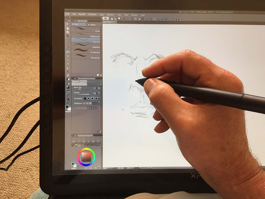 The Artist 16 begs to be taken off its desktop stand and used on the lap. Three cables connect precariously off the left side of the tablet.
