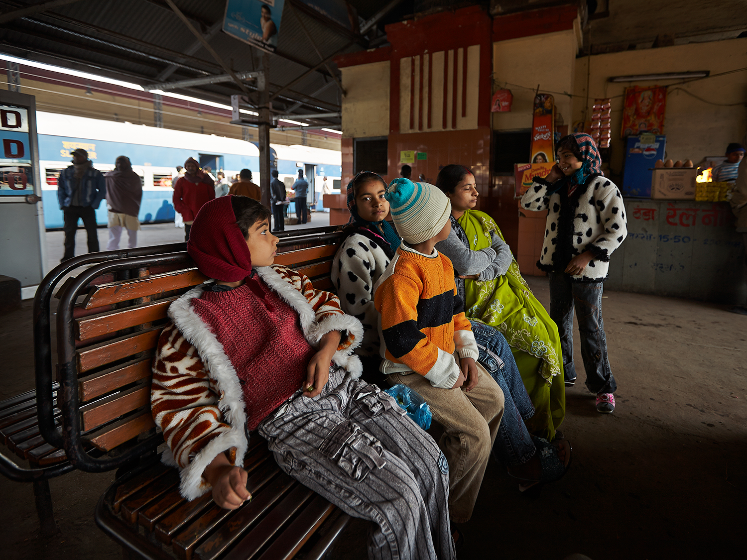 A family waiting for their train at the MughalSarai Station