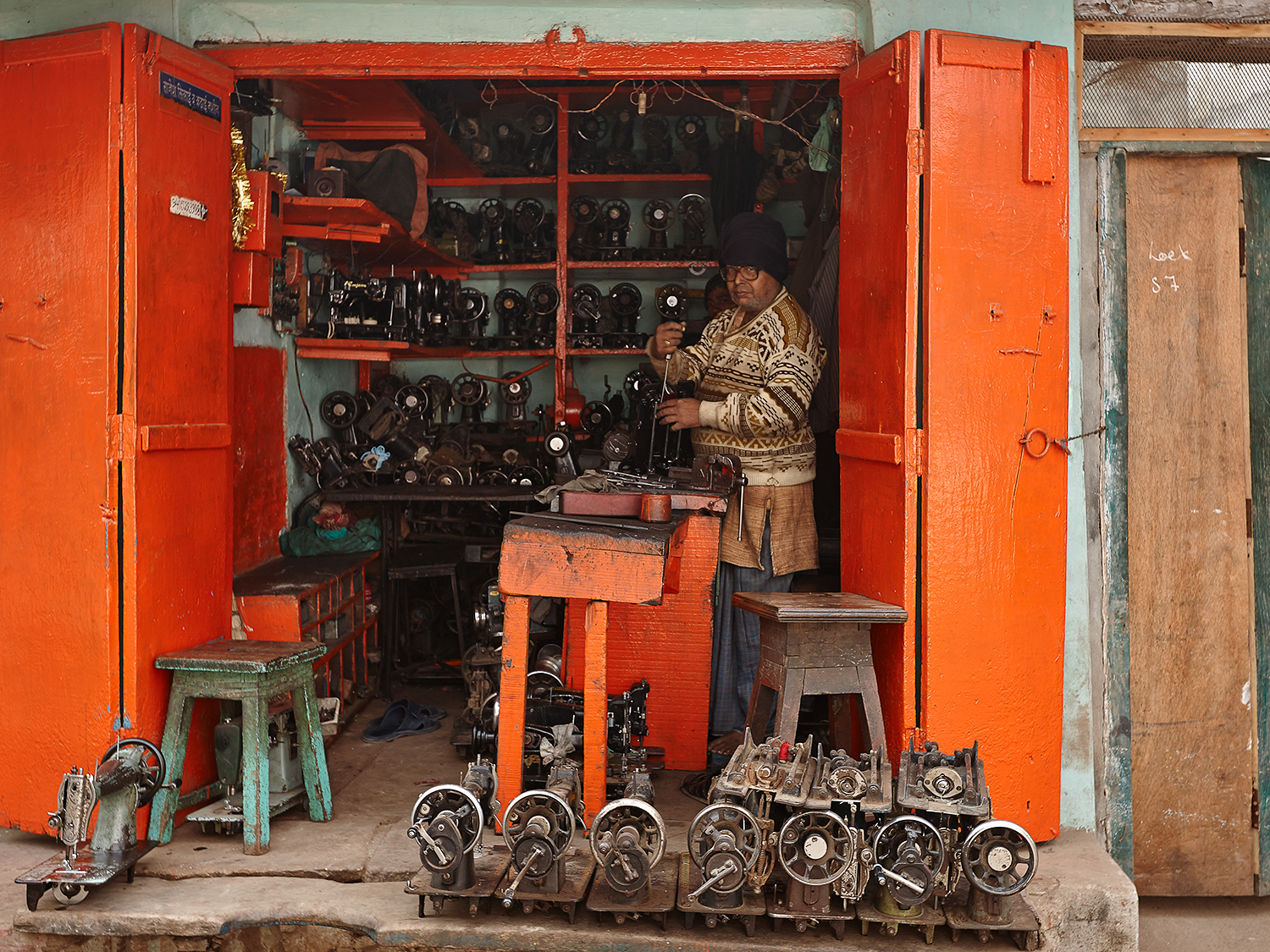 A Sewing-machine mechanic in his workshop