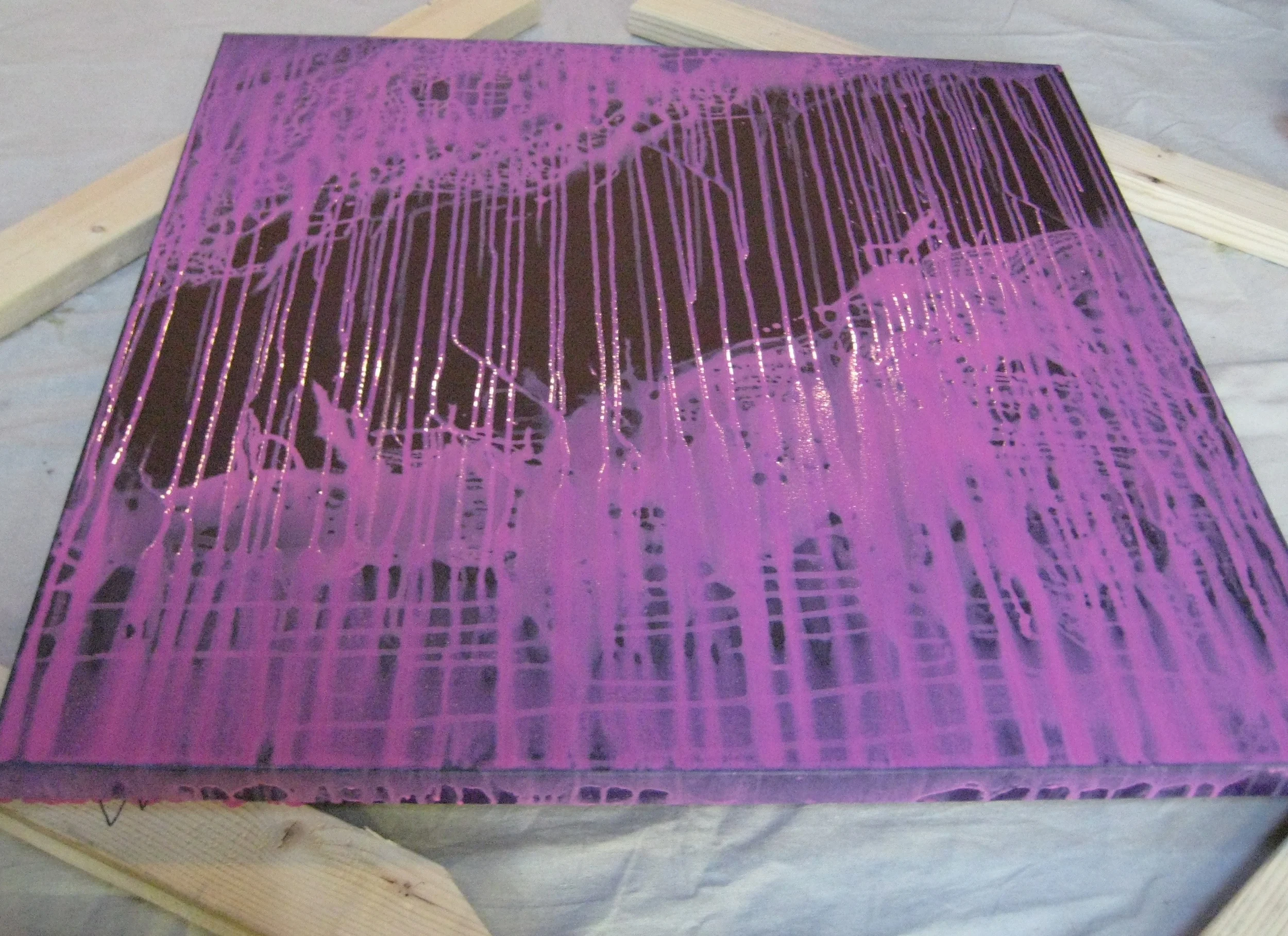 New layer of paint drying - magenta on plum background