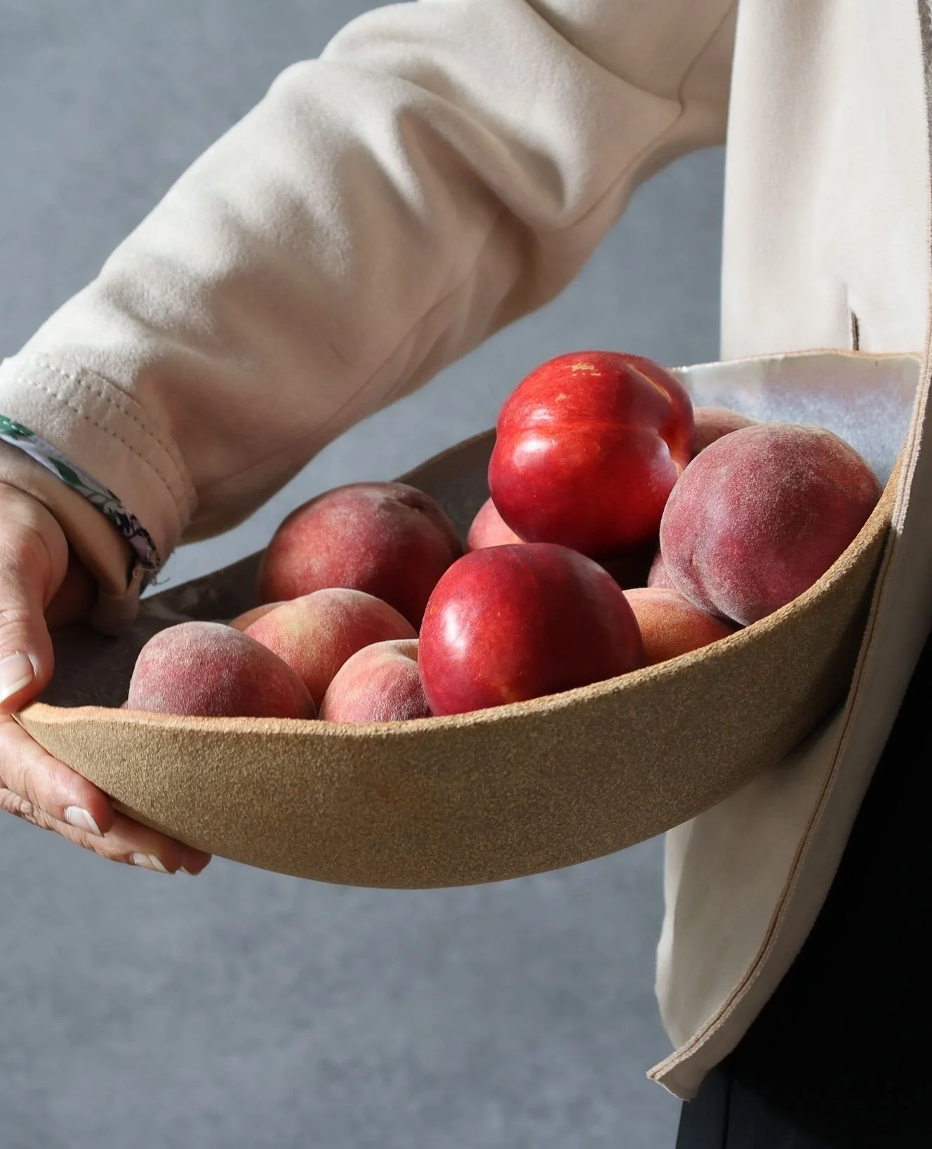 Stone outside, shimmery inside. Swipe right for glaze details.⁠
⁠
This bowl was handbuilt from a slab&mdash;no wheel, just quiet shaping. The interior glaze moves like oil on water: purple into blue, into green, with matte speckling that breaks the g