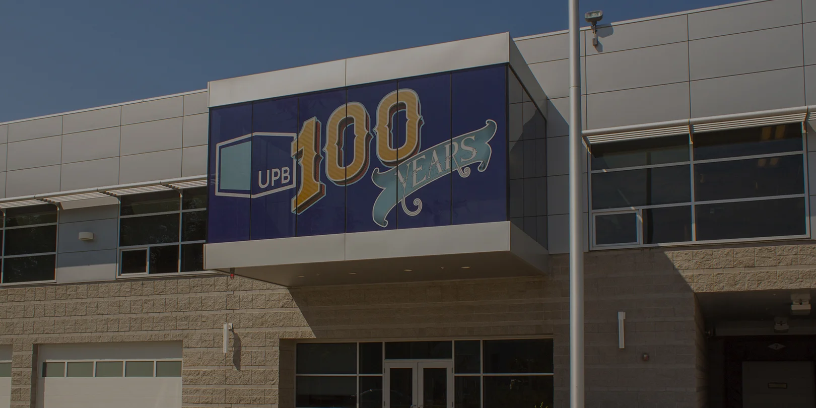 UPB 100th Window Wrap 6x3 Dark.jpg