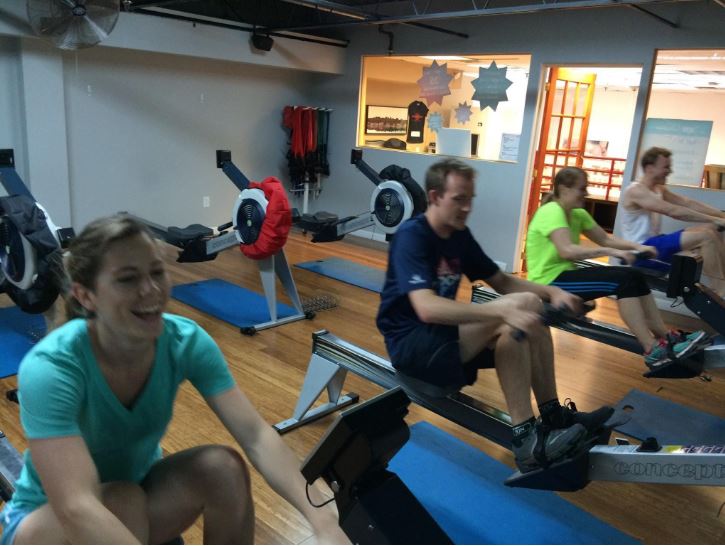 Eliza and Geoff of Adventure Is Out There bond over some rowing machines during Xplore Philly. The two teammates would eventually marry and now race together as husband and wife. 