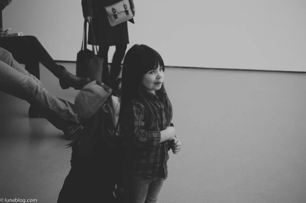 Eve looks on, unimpressed by a multi media display in NYC's Museum of Modern Art.