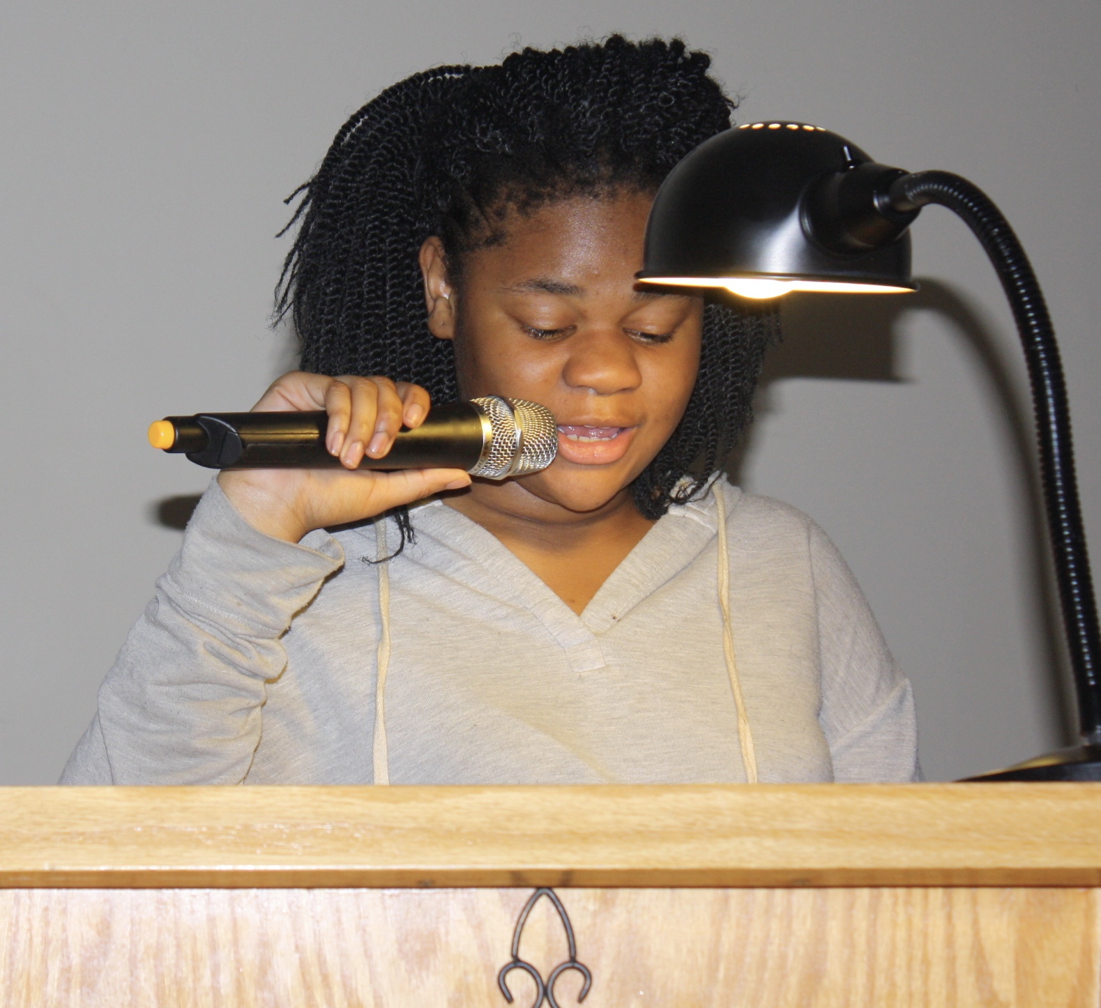   Youth Reading Scripture During Ash Wednesday Service  