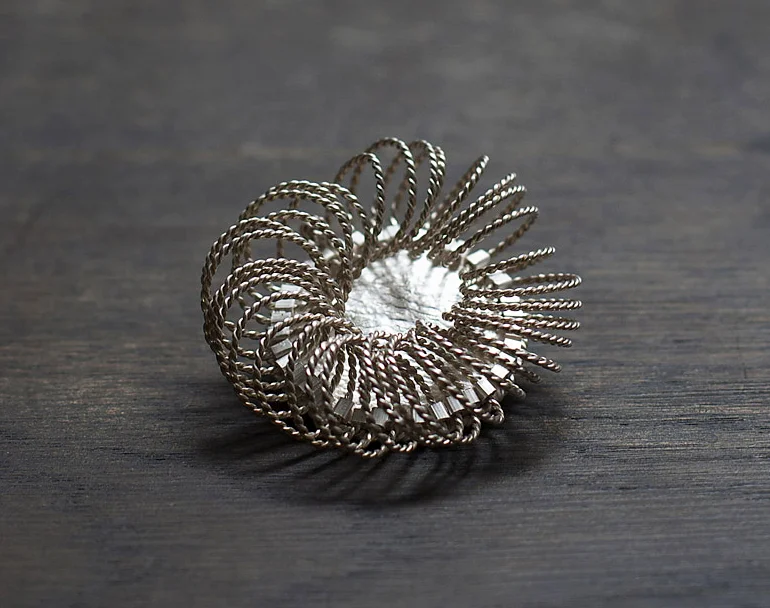 Cycle Brooch, 2012, sterling silver.