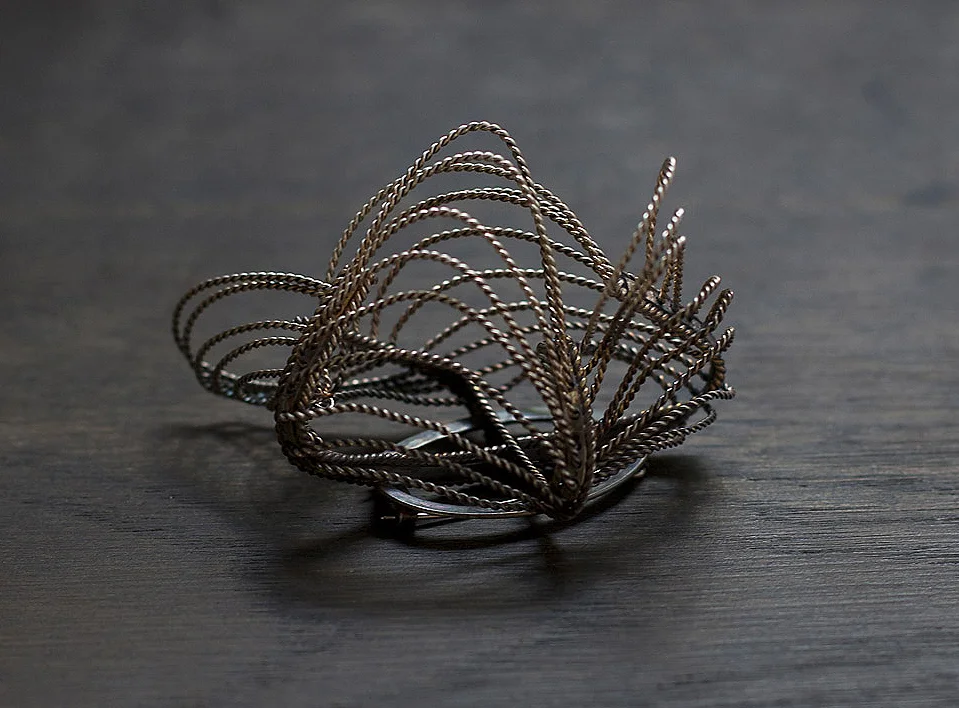 Freeflow Brooch 2012, partially oxidised silver.