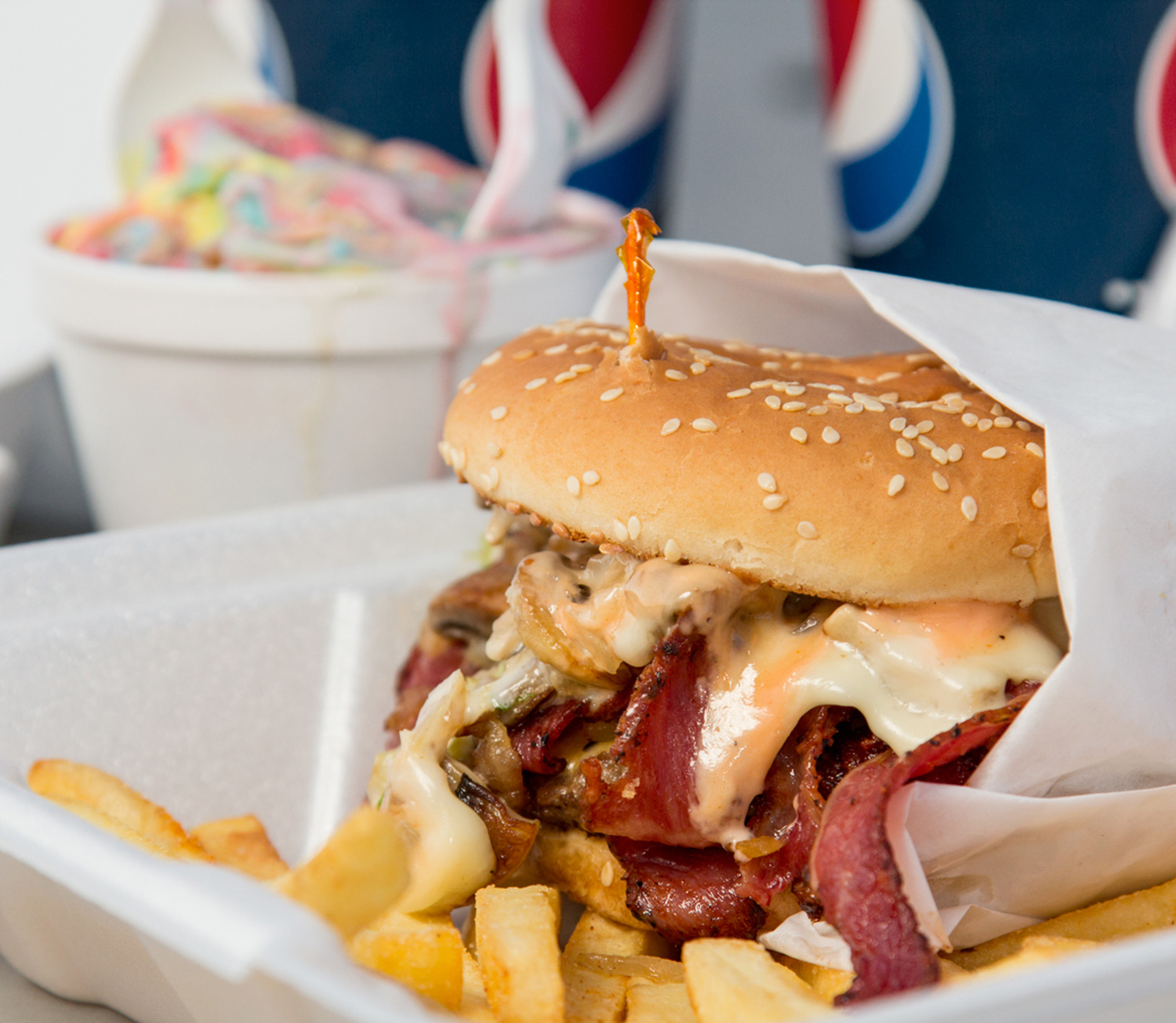 Pastrami burger, Fries, and Superman Ice Cream