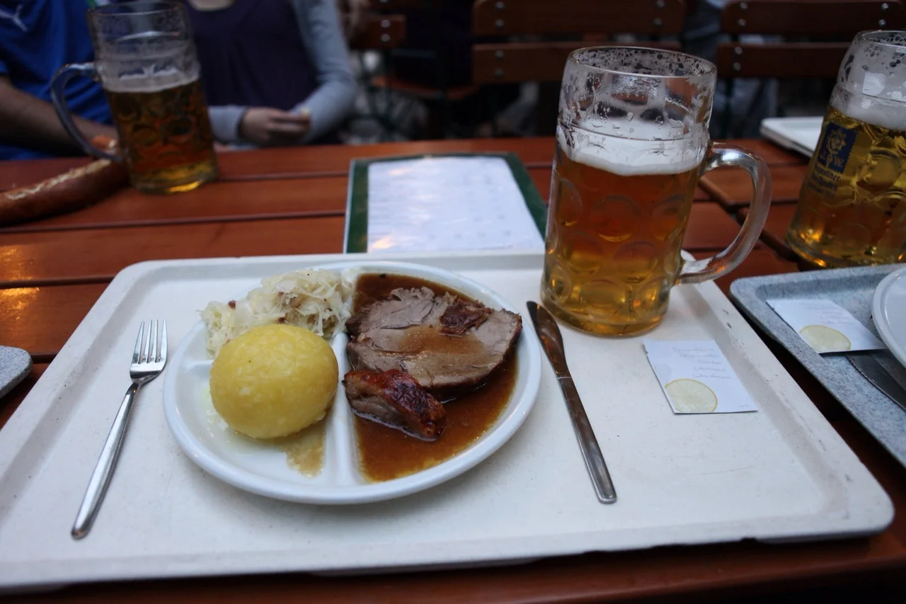 A most amazing dinner of potato dumpling, roast pork, and a huge stein of beer.