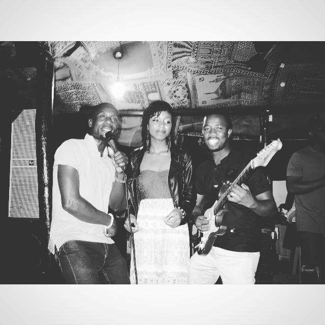 Tyné singing with a band in Ghana.