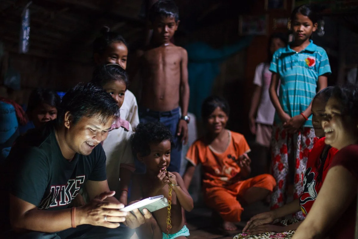 An Alongsiders Coordinator uses a smartphone Android App to register new Alongsiders in rural Cambodia.