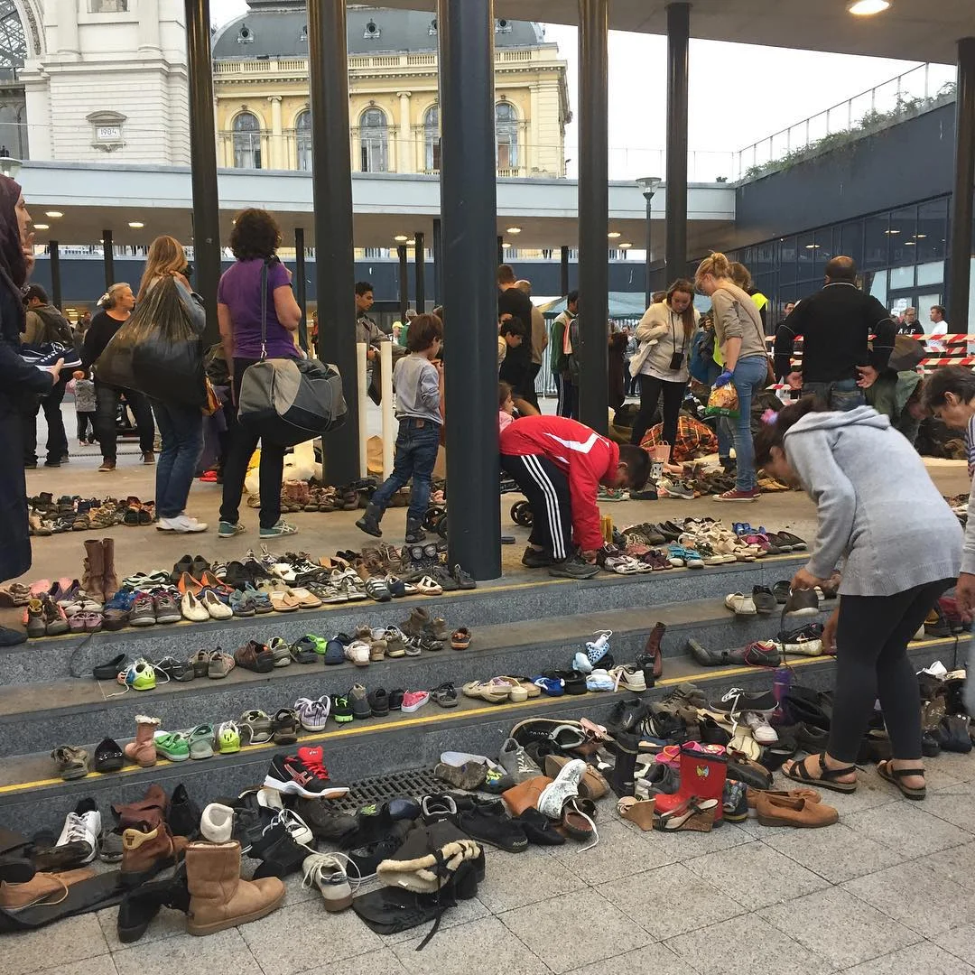 Bless their soles. Hungarians leave shoes for refugees at a Budapest railway station.