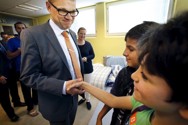 Finnish Prime Minister Juha Sipila rocks his hipster glasses at a refugee reception centre in Oulu.