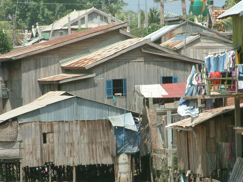 The house with blue windows in this photo was our second home in this slum, built over a sewer canal. Eventually we were all evicted to make way for an overpass.