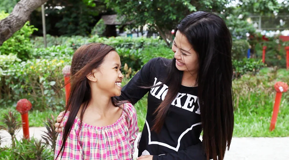 Srey Ta (on the right) is one of my heroes. She lost her father at a young age and grew up in an urban slum. But despite those challenges, she has become a mother, a teacher, and an Alongsider to another little girl in the same community.