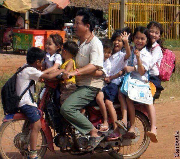 Who needs public transport to get to know your neighbours? This is how we roll in Cambodia. Yeehar!