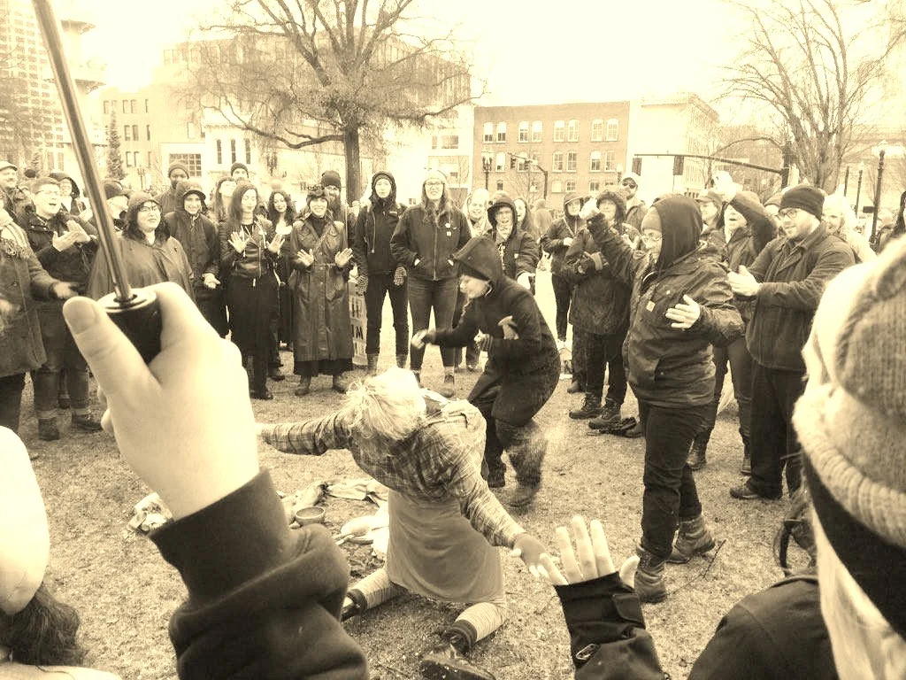 Queer Witches Bash Back: Rhea and others give/receive an exorcism of the patriarchy at a public ritual on January 21, 2017.