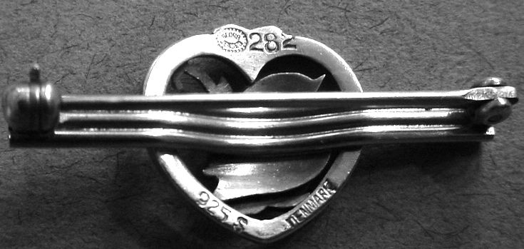 Different hallmarks were often used on different pieces due to space limitations. The second 2 in the model number is slightly cut off, and although the regular Georg Jensen hallmark is present on this example of a post 1945 piece, the GI mark is more common on tiny pieces.