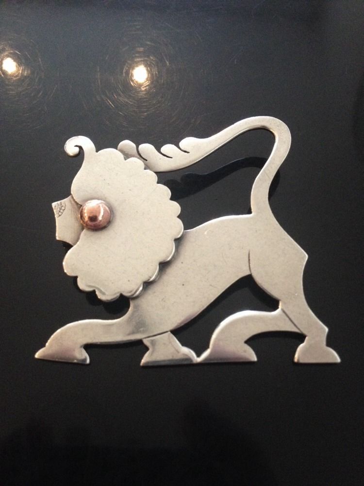 This unusual brooch actually uses the Georg Jensen hallmark to form part of the decoration of the nose of the lion. We're unsure if this is intentional or another example of a mistake in the stamping process, but it is, nevertheless, very unusual.