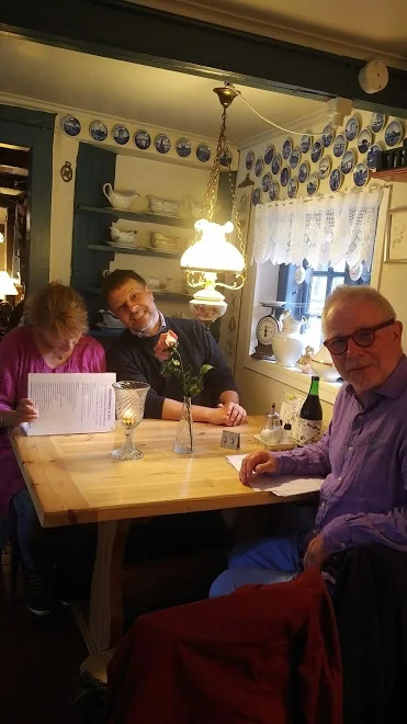 now, at the mainland seeland denmark, village inn near ringsted, meeting the locals, i guess a farmer and his wife, charming a big smile.