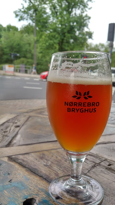 in copenhagen, keeping an eye on the traffic and the beer