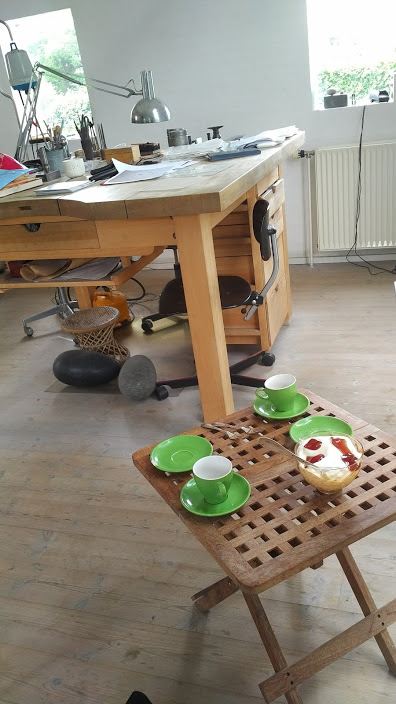 coffee and homemade danish apple cake with whipped cream, served in anette's work shop, it is quite easy to gain pounds visiting denmark.