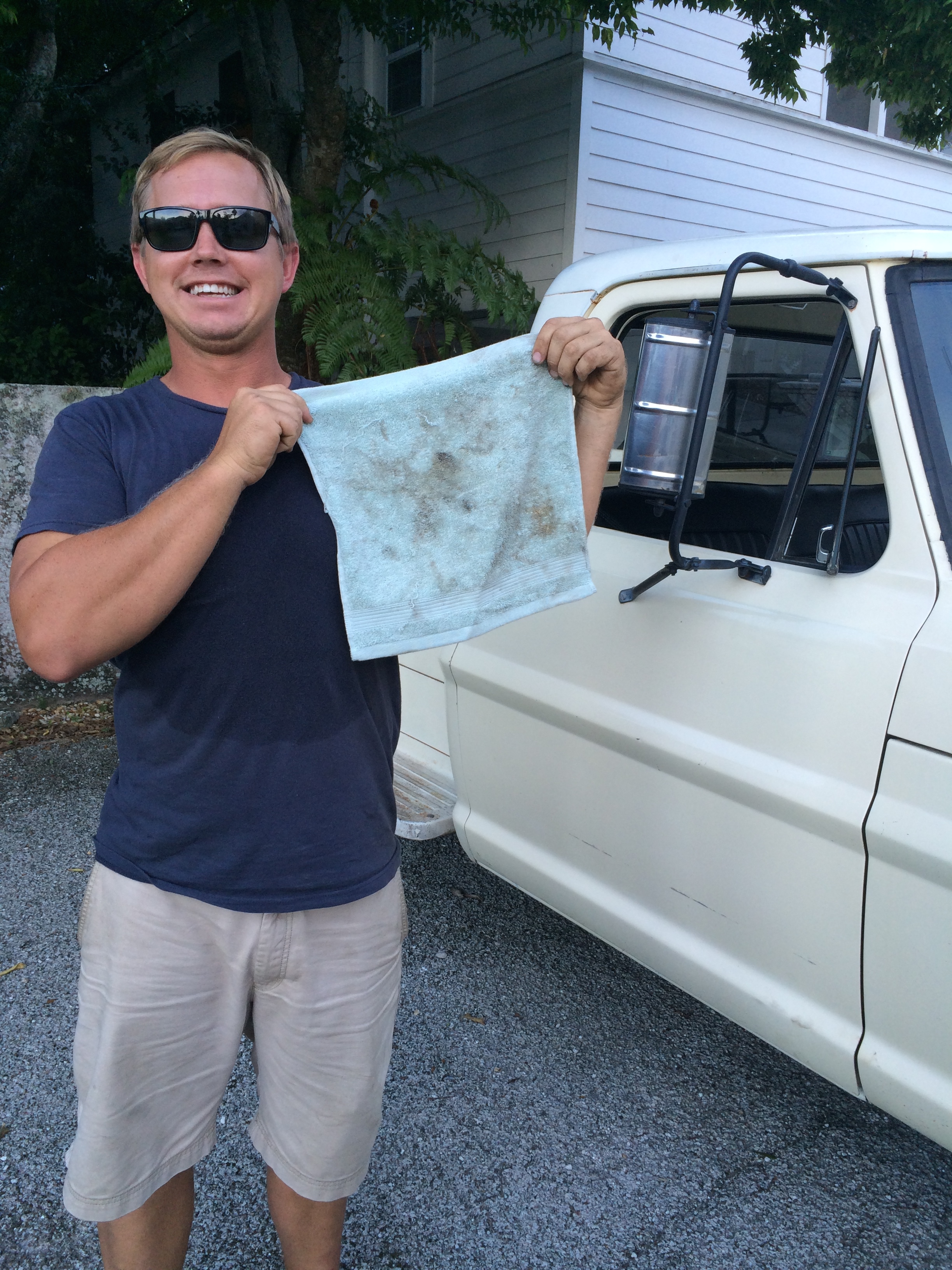 Jon working on his truck with a nice bathroom wash cloth...