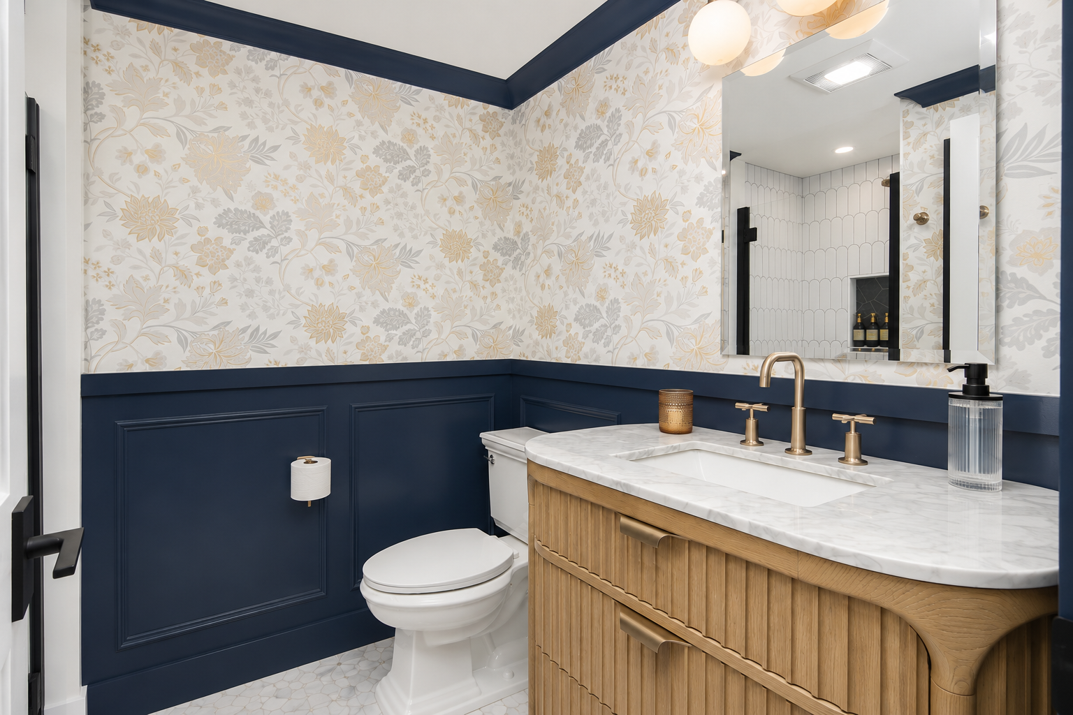 A powder room with oak vanity, custom wallpaper and painted wainscoting