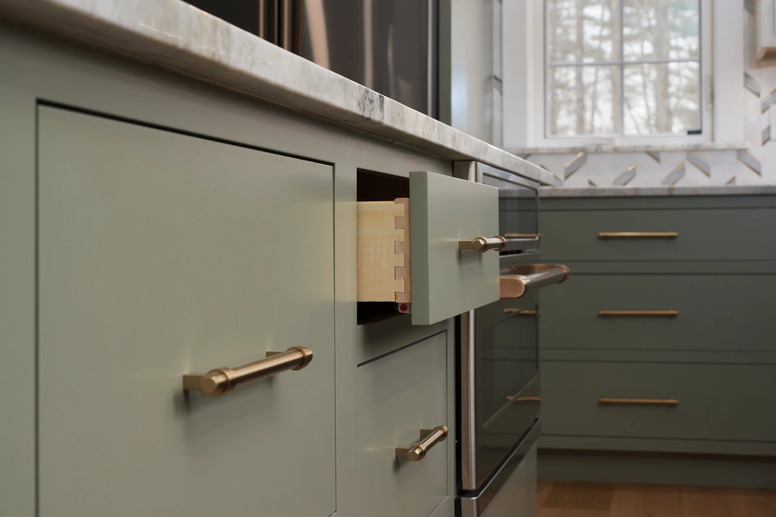 Sage green cabinet draws with dovetail joinery