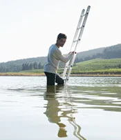 man in ladder in water.jpg