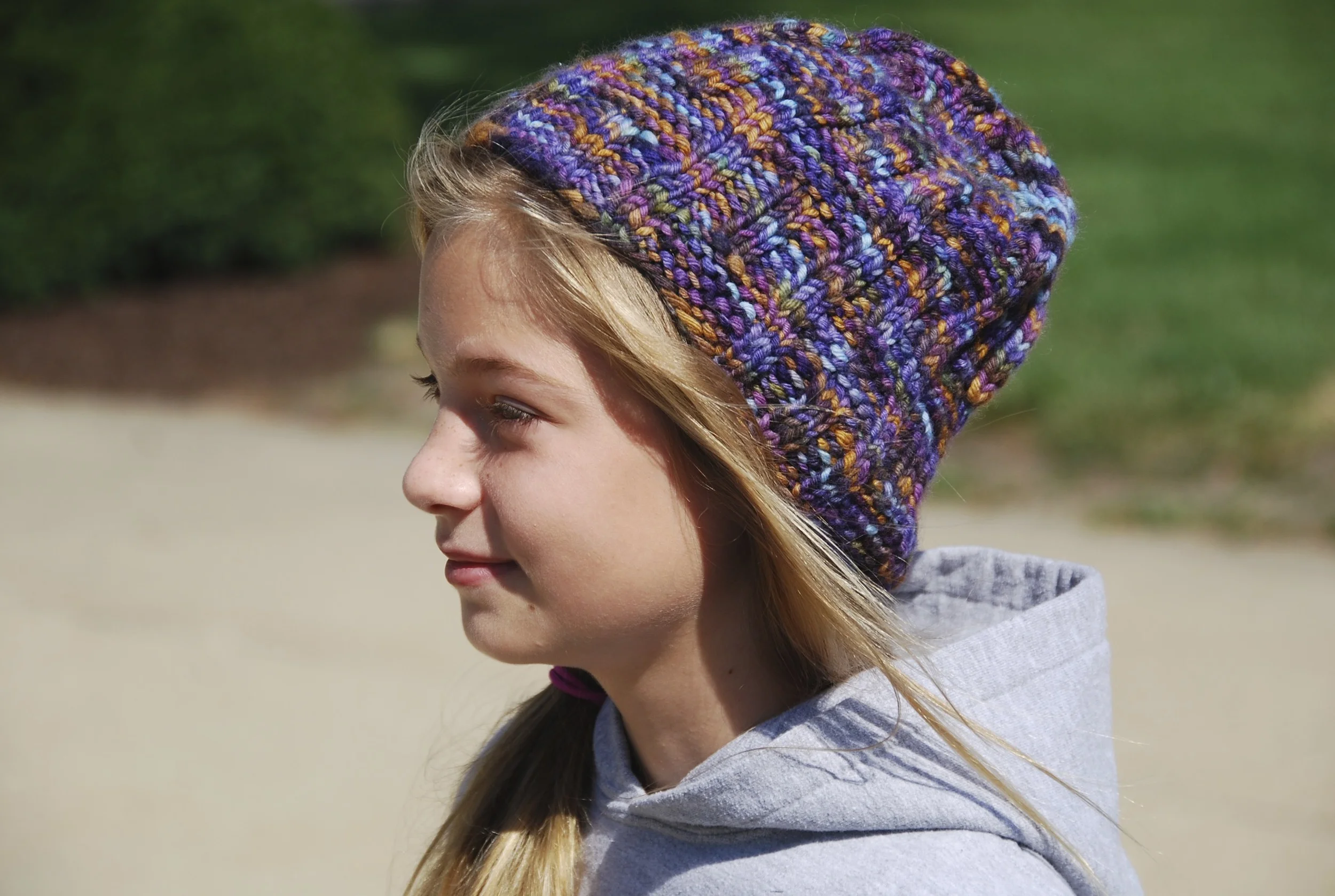 Rachel in the Woman's Wavy Gravy hat in Malabrigo Twist.
