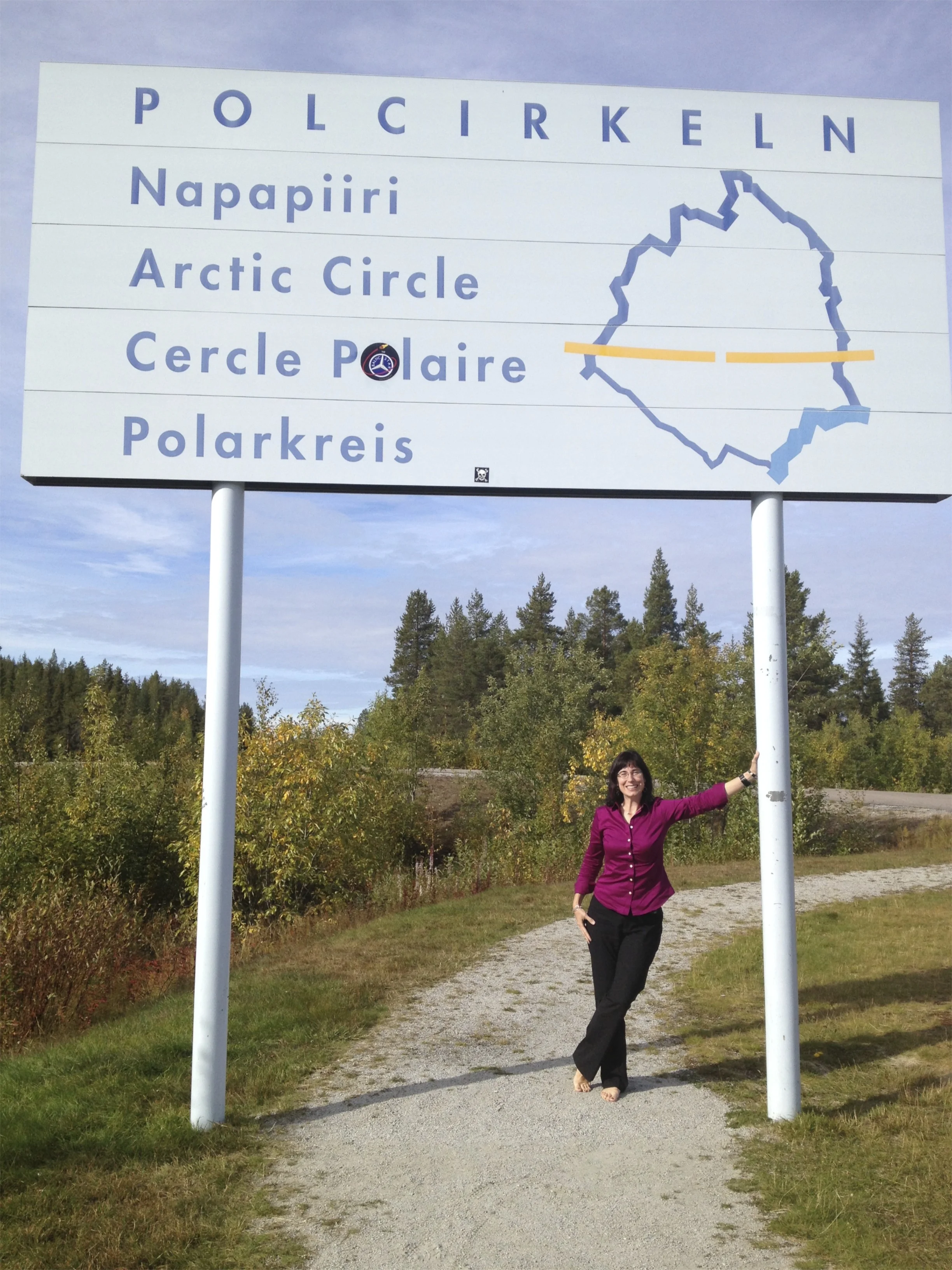 As you can see, my feet are just beyond the signpost, so I am in the Arctic circle!