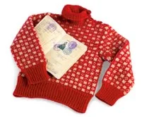 picture of Kind Harald's wartime sweater and passport, taken by Kjartan Hauglid, The Royal Court