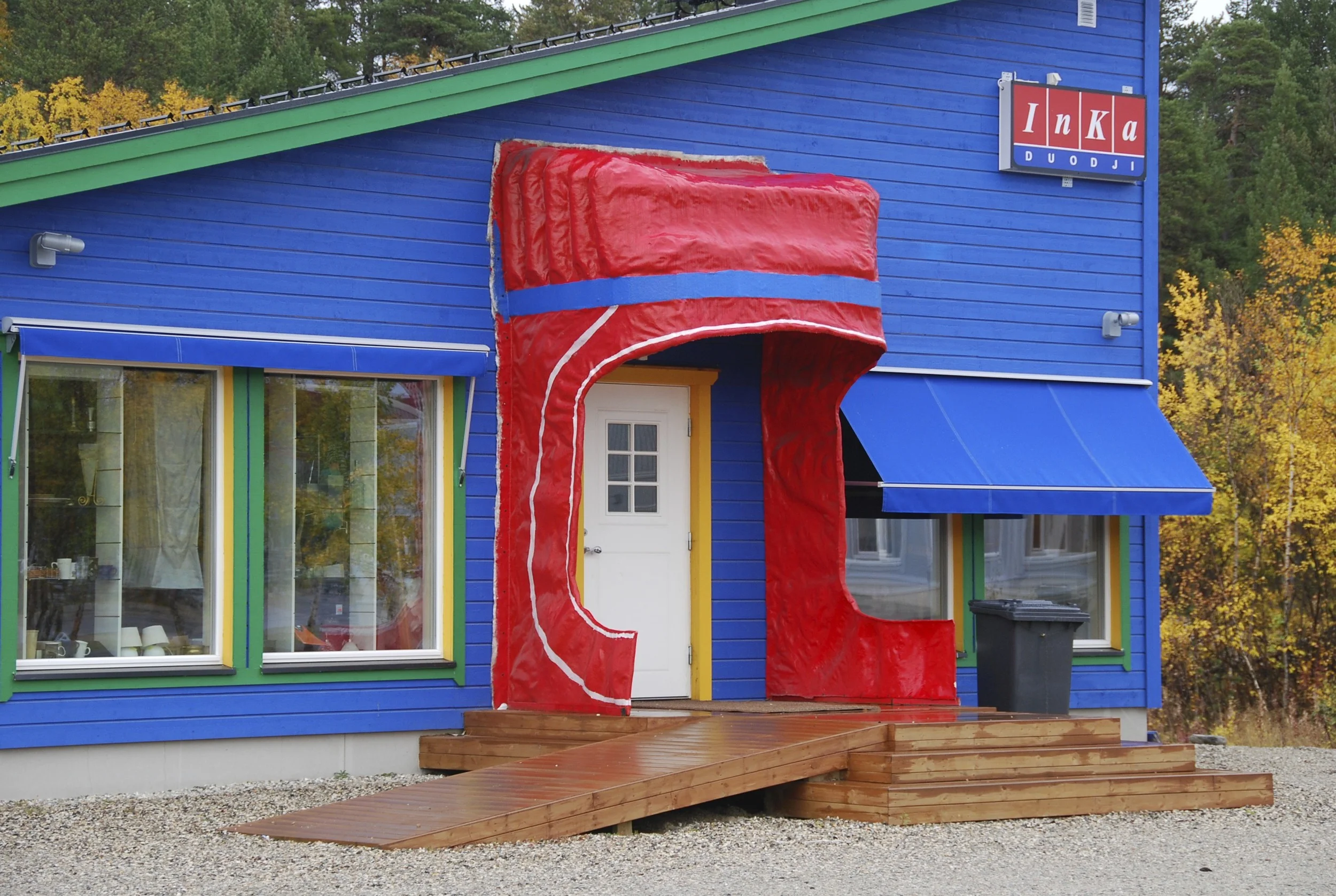 A handcraft shop in Karasjok that has a hilarious door covering that mimics a woman's cap.