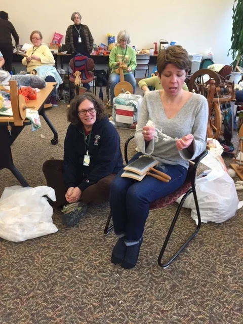 Kate Larson (with Susan Markle, owner of the Trading Post on the floor)