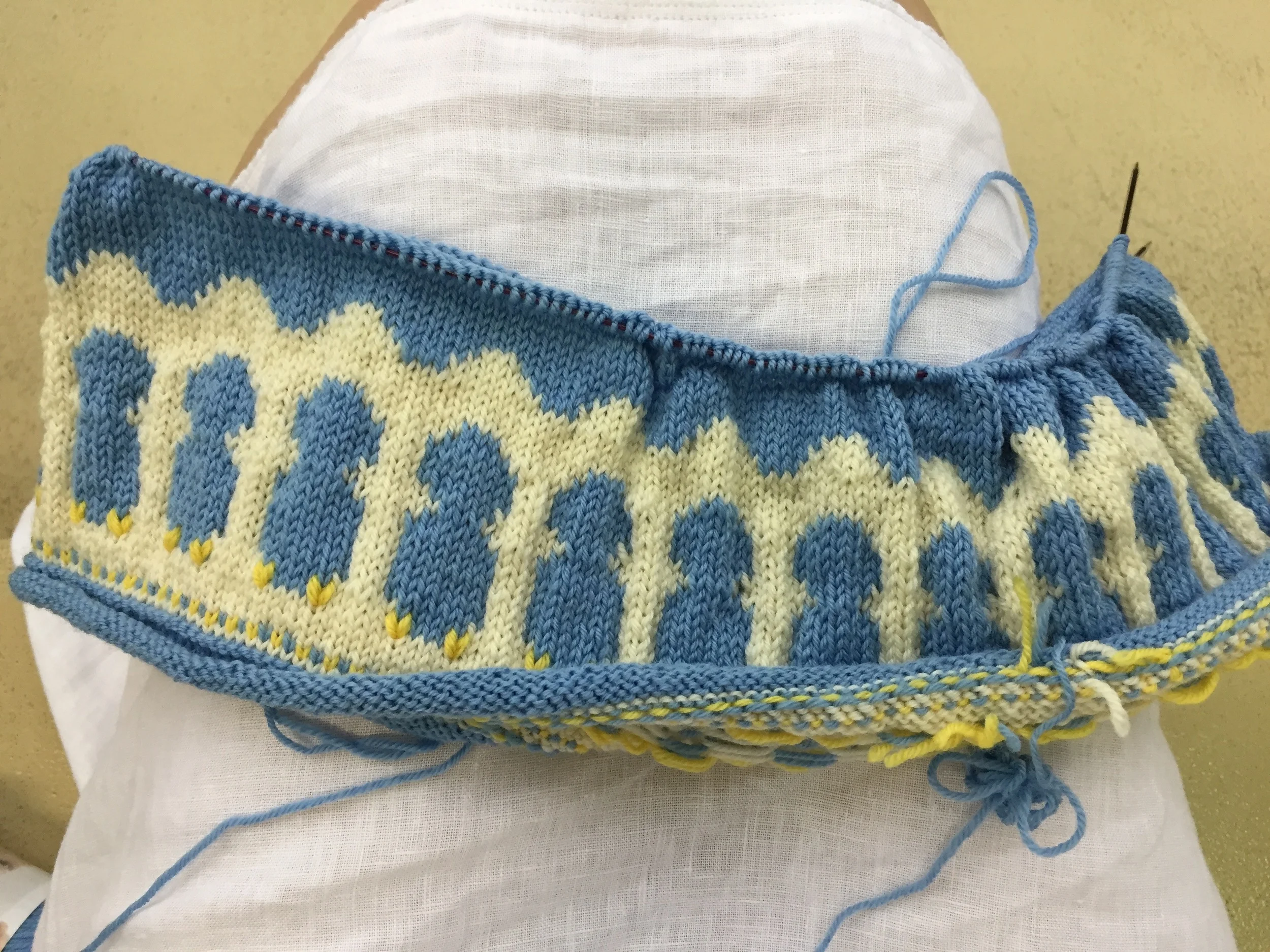 Bottom hem of the Baby Chicks dress -- A Dale design. I still need to add the eyes and beak.