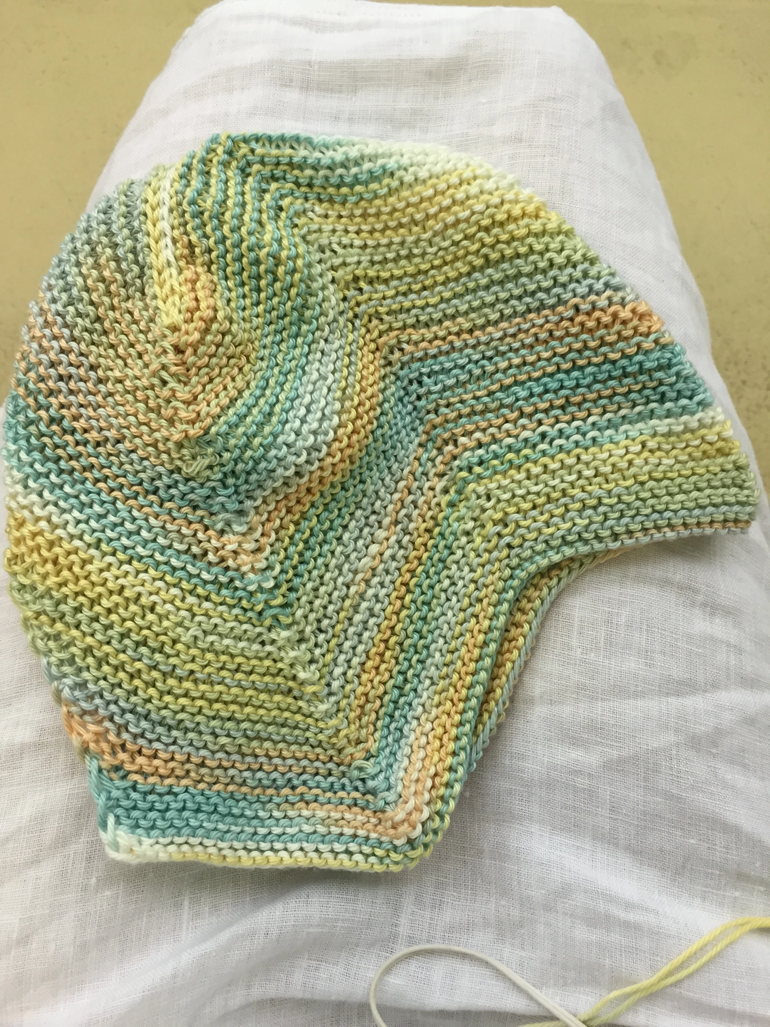 Garter Stitch baby cap before i-cord ties.