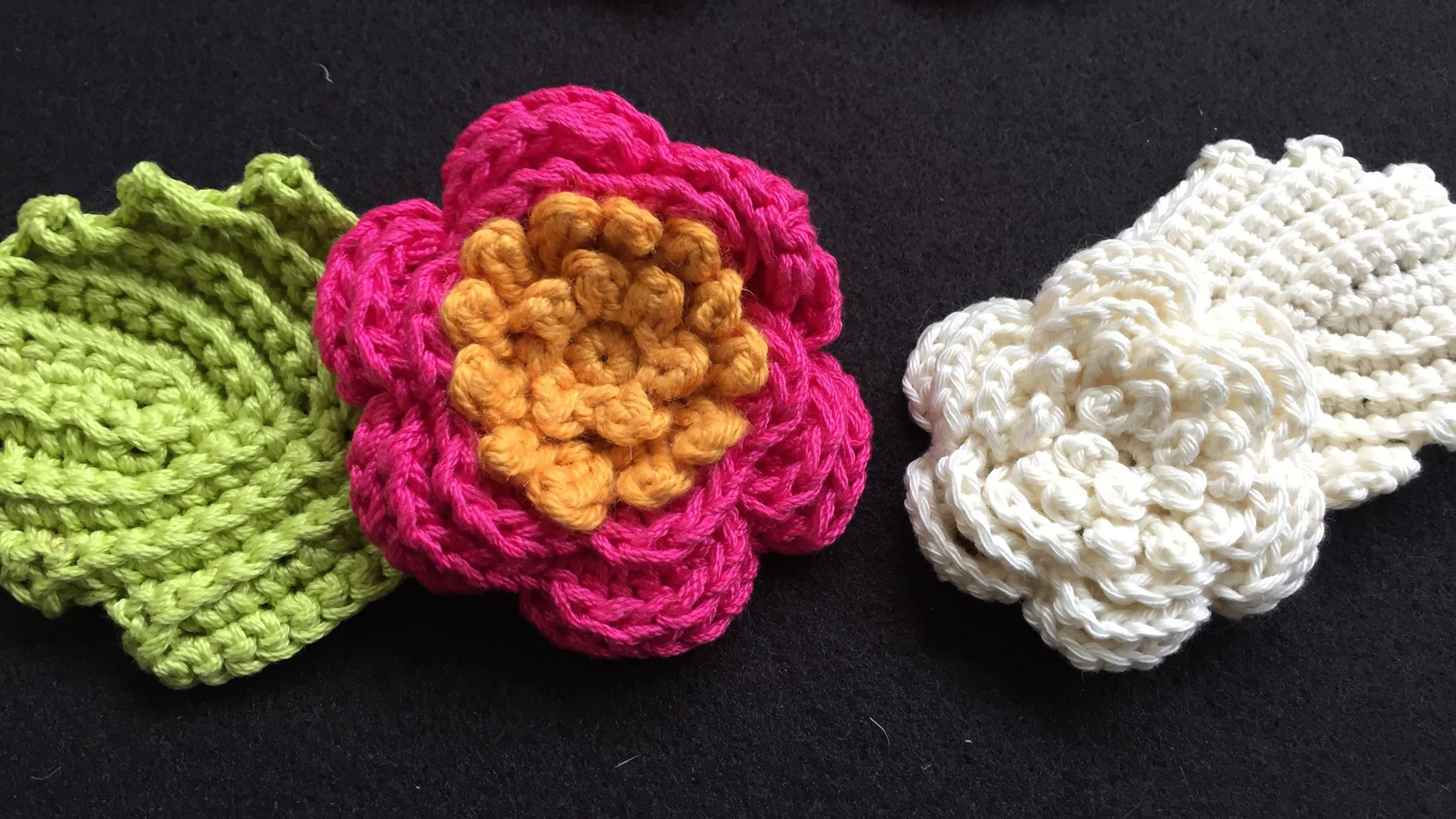 Irish crochet rose, leaf and stamen seen in colored, worsted weight yarn, and cream, dk weight yarn