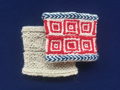 Class wrist warmer cuffs, knitted in a solid color, and three different colored z-spun yarns