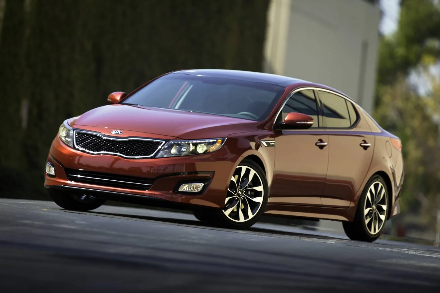 Kia Optima - everything I just said about the Santa Fe (left) ... only it's a car