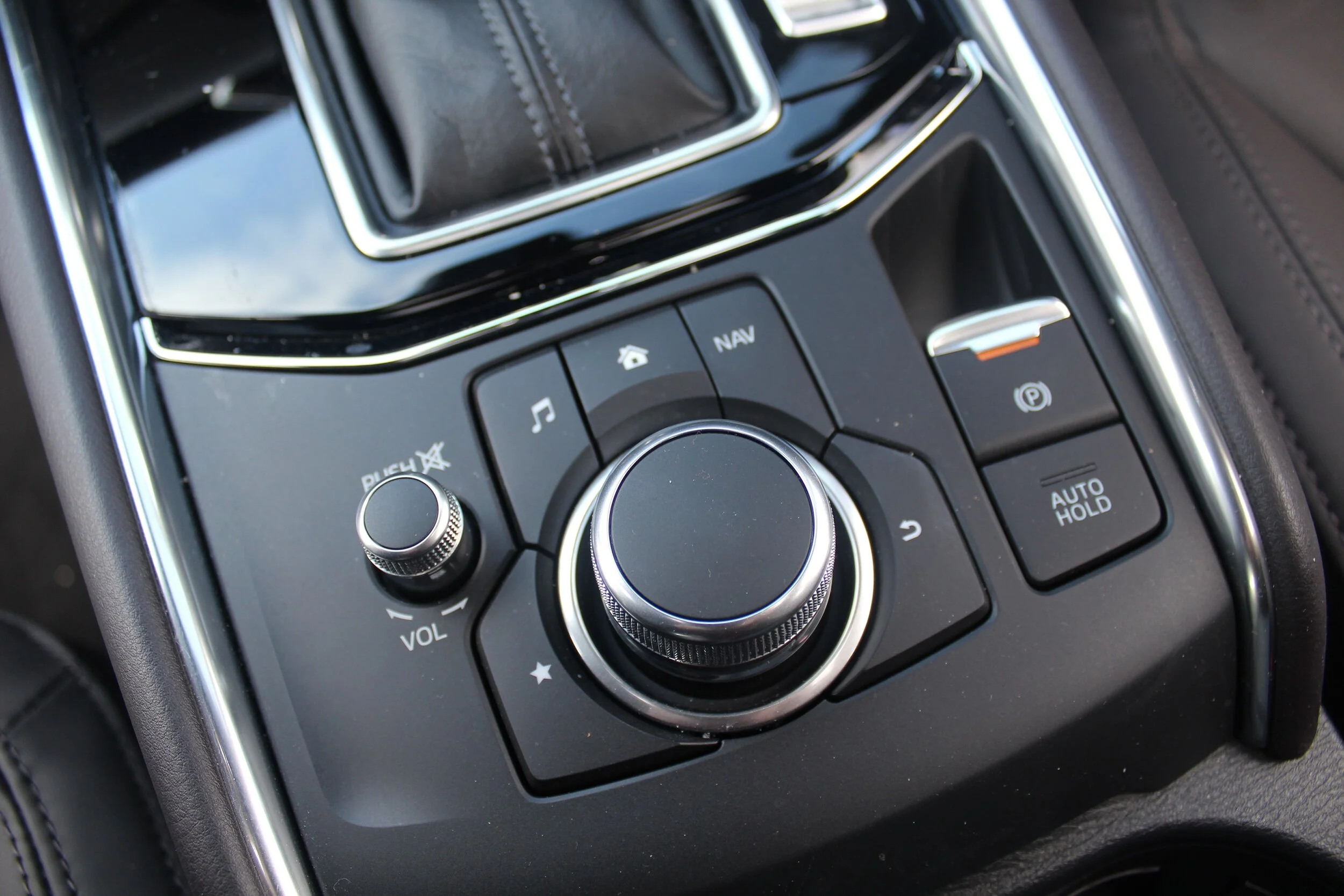 Rotary dials are not ergonomic while driving.